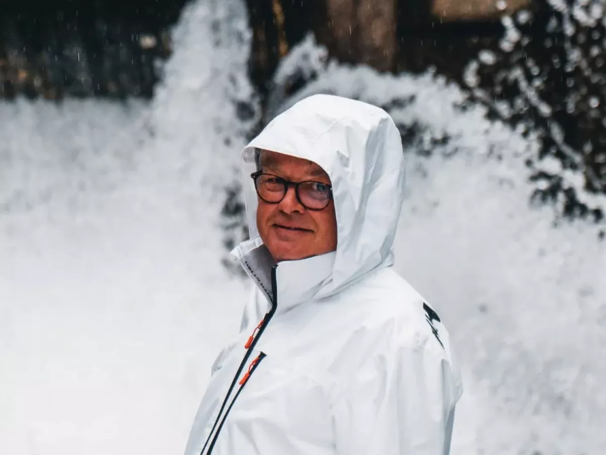 An electric yacht sails towards the open sea.