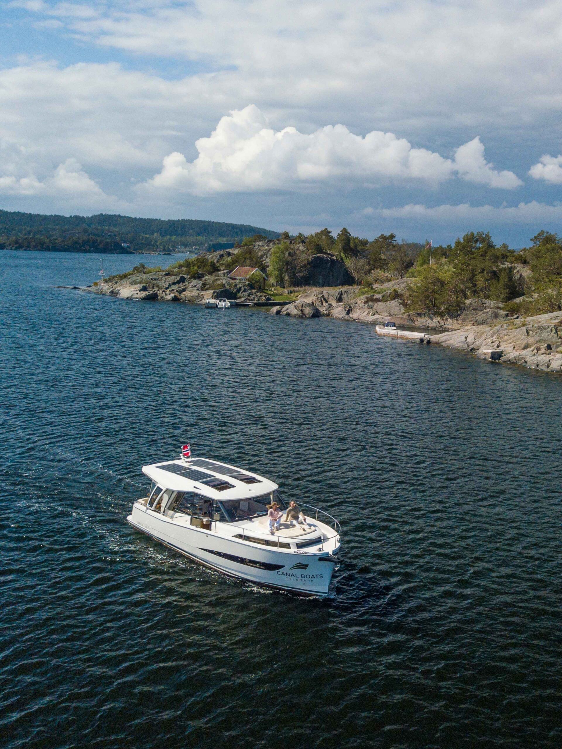 Group Getaway on Norwegian coastline by electric boat